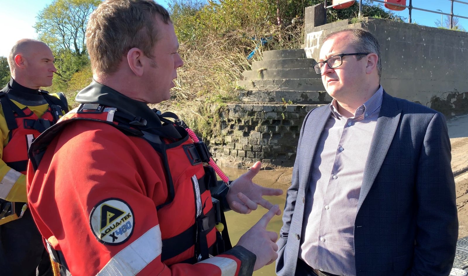 Marc speaking with a member of the emergency services